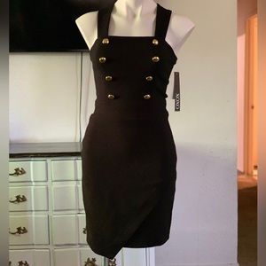 Black mini dress with gold buttons.